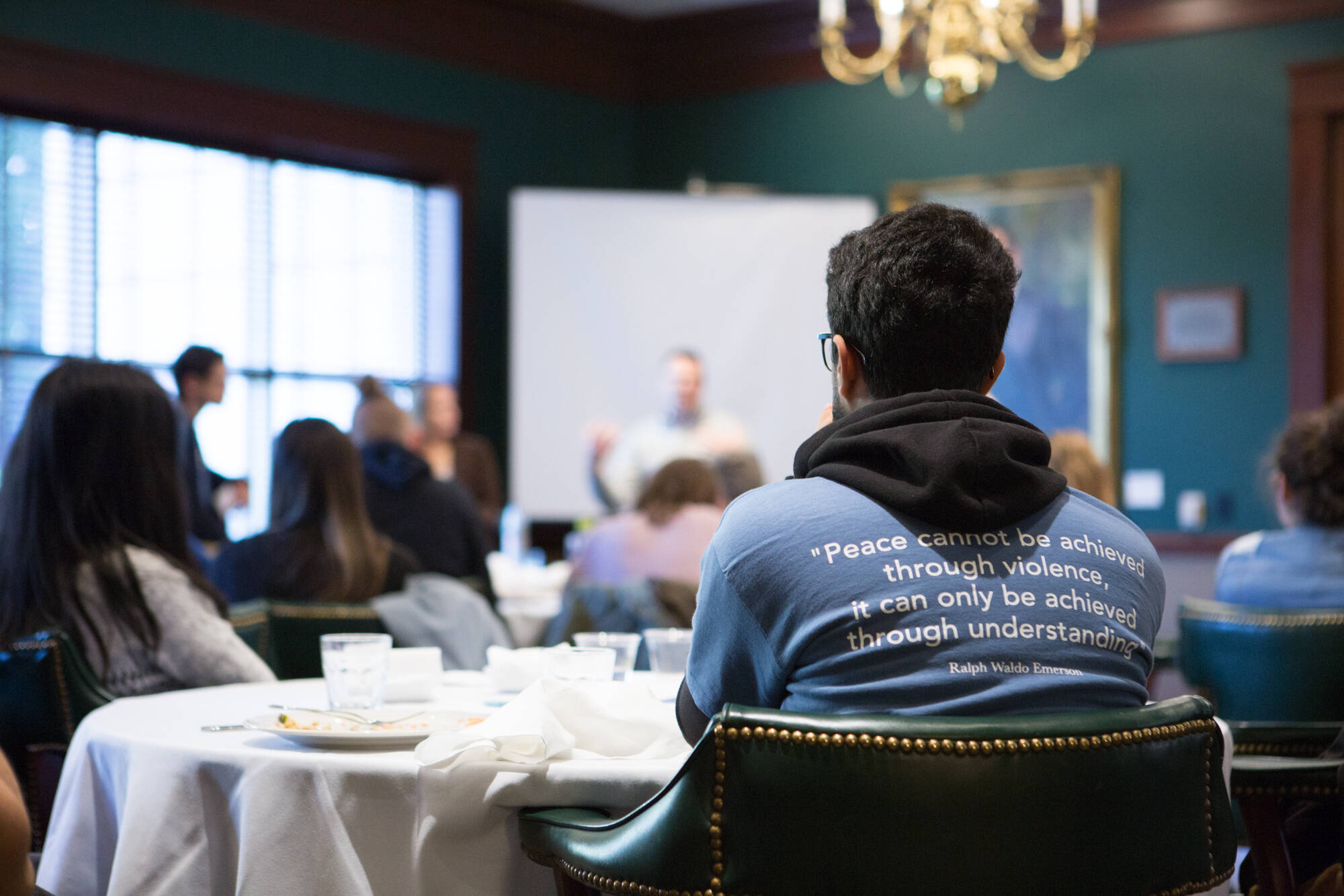 Students watch a speaker at MIMIL